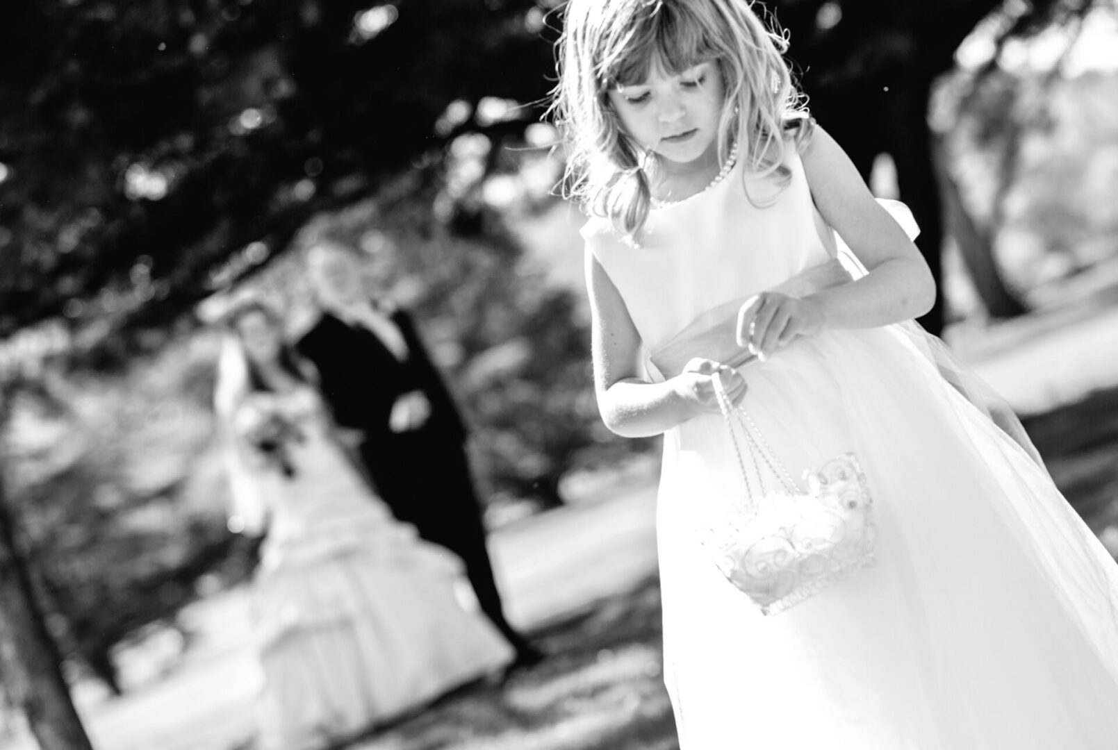 a little girl with a flower basked in her hand