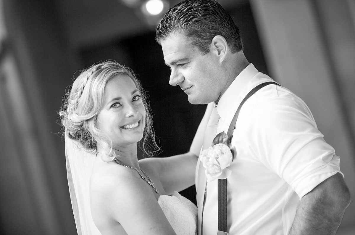 A black-and-white photo of a newlywed couple