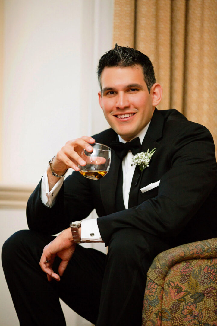 A handsome bride with a glass of whiskey