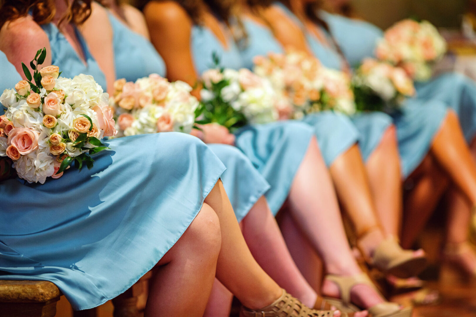 Legs image of so many ladies holding flower bunches