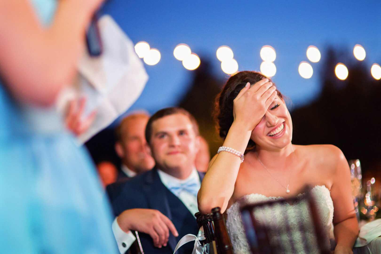 Close up shot of a girl laughing at a party