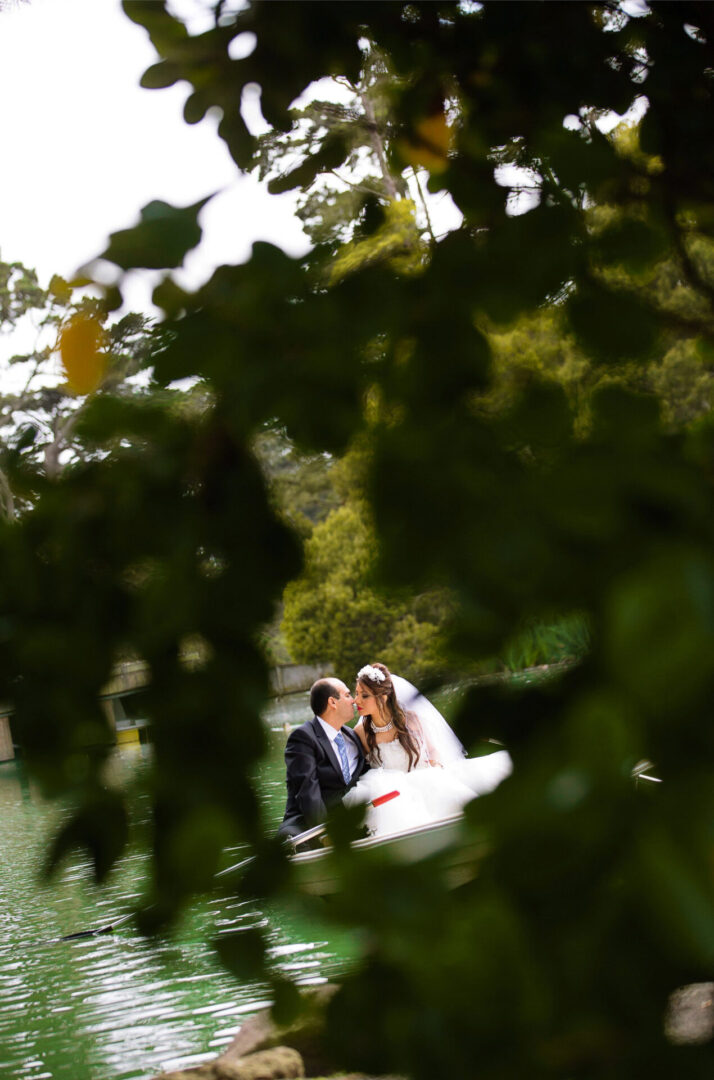 Bride and groom sitting on a boat