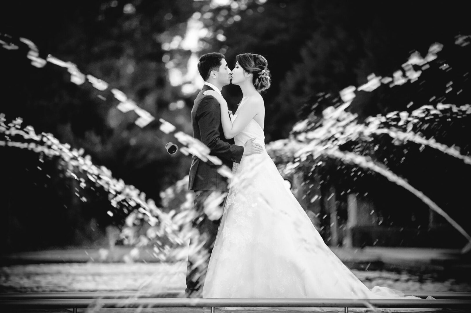 Black and white image of couple kissing